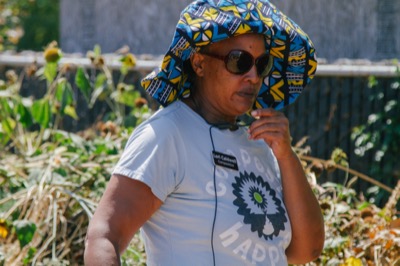 Woman in lush community garden